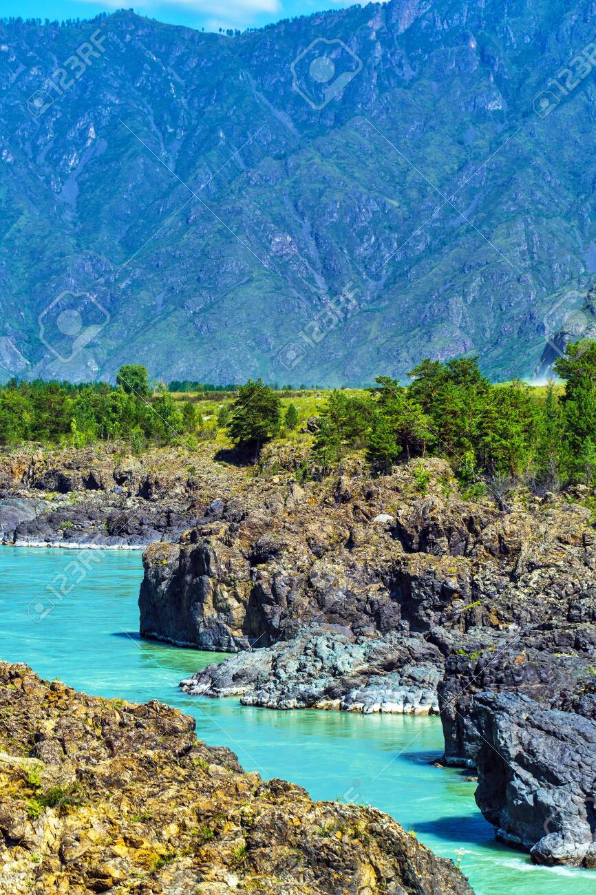Chemal district, Altai Republic, southern Siberia, Russia - August 15, 2019: a view of the Katun river and rapids Teldekpen have Oroktoysky bridge - 129773597 Chemal district, Altai Republic, southern Siberia, Russia - August 15, 2019: a view of the Katun river and rapids Teldekpen have Oroktoysky bridge - 129773597