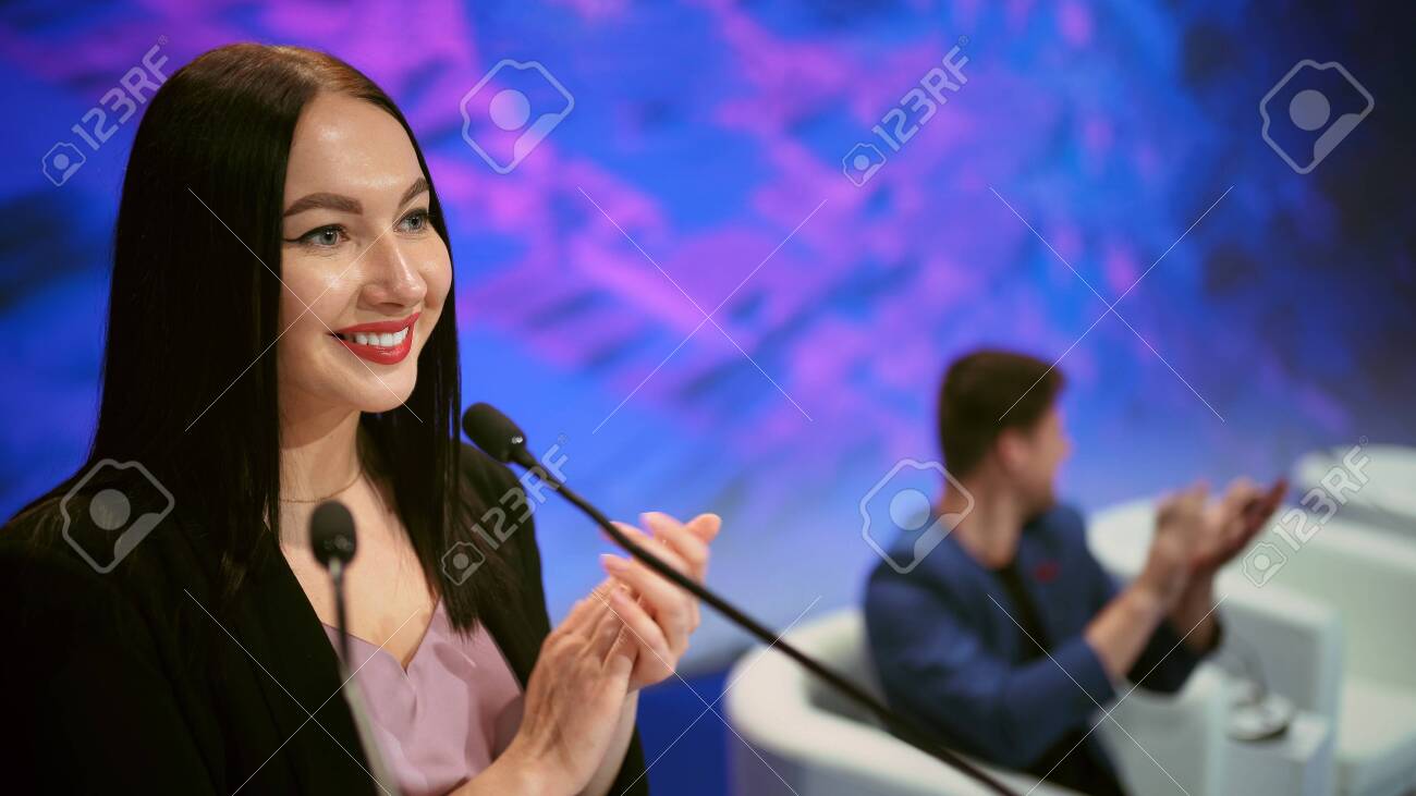 Speaker business meet talk audience from stage in microphone. Presenter economic forum speak public. Educational speech business woman. Speaker talking group people at summit. Presentation women. - 156059786 Speaker business meet talk audience from stage in microphone. Presenter economic forum speak public. Educational speech business woman. Speaker talking group people at summit. Presentation women. - 156059786