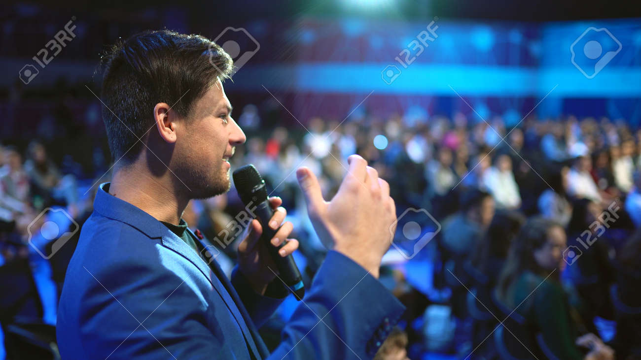 Viewer crowded audience speak with speaker in microphone. Participant forum speaking. Educational speech business man. Speaker group auditorium people. Presenter talk. Education conference spectator. - 158252370 Viewer crowded audience speak with speaker in microphone. Participant forum speaking. Educational speech business man. Speaker group auditorium people. Presenter talk. Education conference spectator. - 158252370