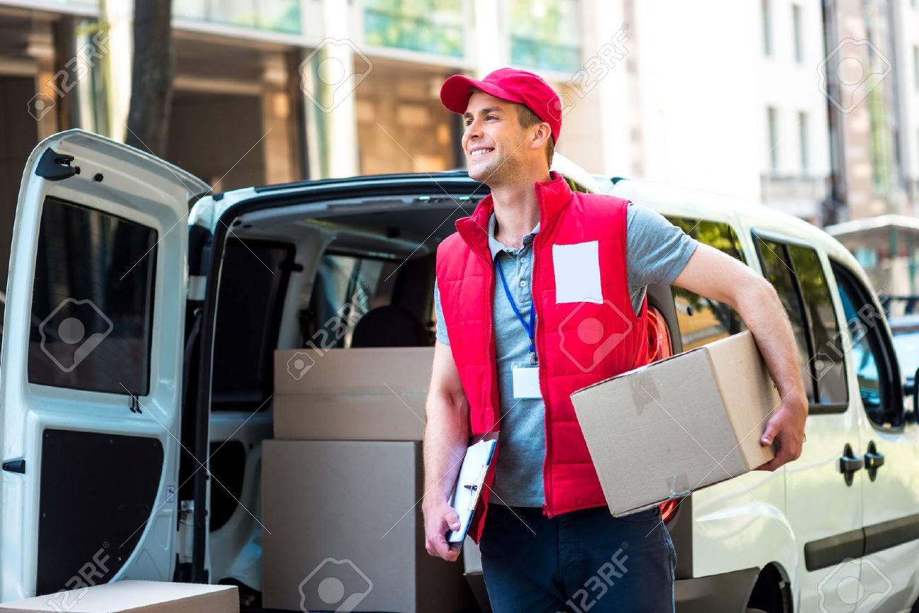Colorful picture of courier delivers package. Courier holding the box and smiling. - 44007116 Colorful picture of courier delivers package. Courier holding the box and smiling. - 44007116