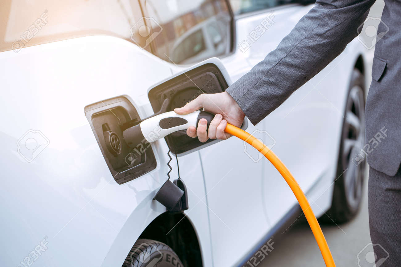 Man transportation by modern eco car charge energy - 80941138 Man transportation by modern eco car charge energy - 80941138