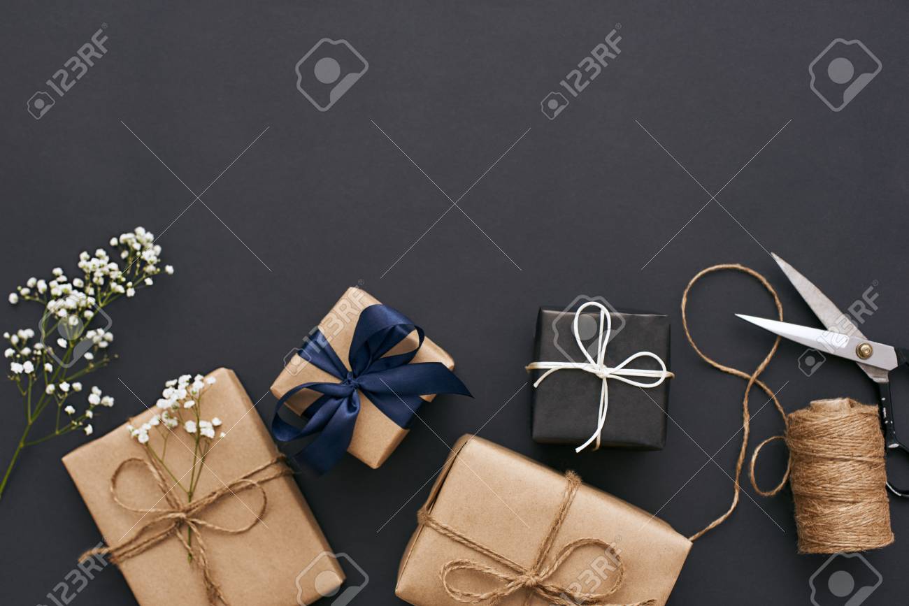 Preparing for holidays. Handmade gift boxes with beautiful decoration for friends - 117238312 Preparing for holidays. Handmade gift boxes with beautiful decoration for friends - 117238312