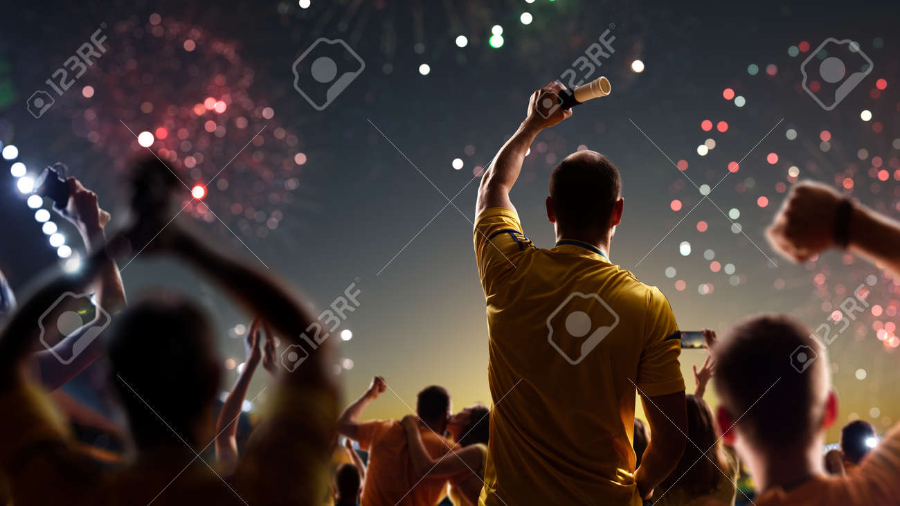 Fans celebrate in Stadium Arena night fireworks - 157466790 Fans celebrate in Stadium Arena night fireworks - 157466790