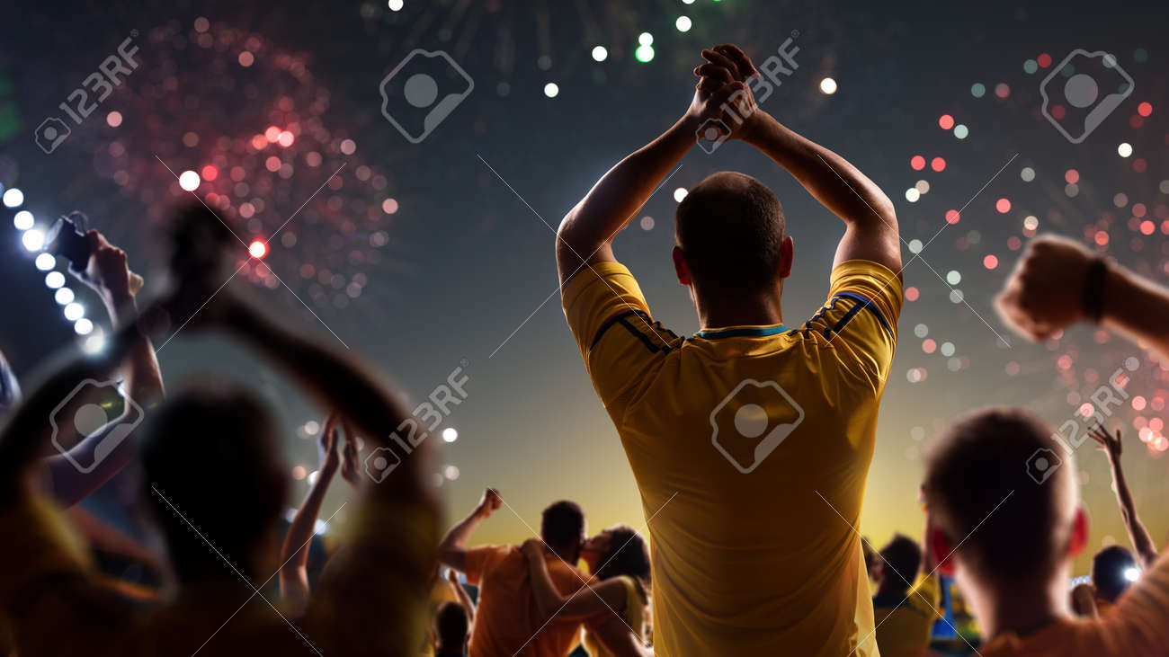 Fans celebrate in Stadium Arena night fireworks - 157466842 Fans celebrate in Stadium Arena night fireworks - 157466842