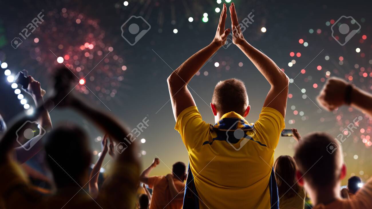 Fans celebrate in Stadium Arena night fireworks - 157292125 Fans celebrate in Stadium Arena night fireworks - 157292125