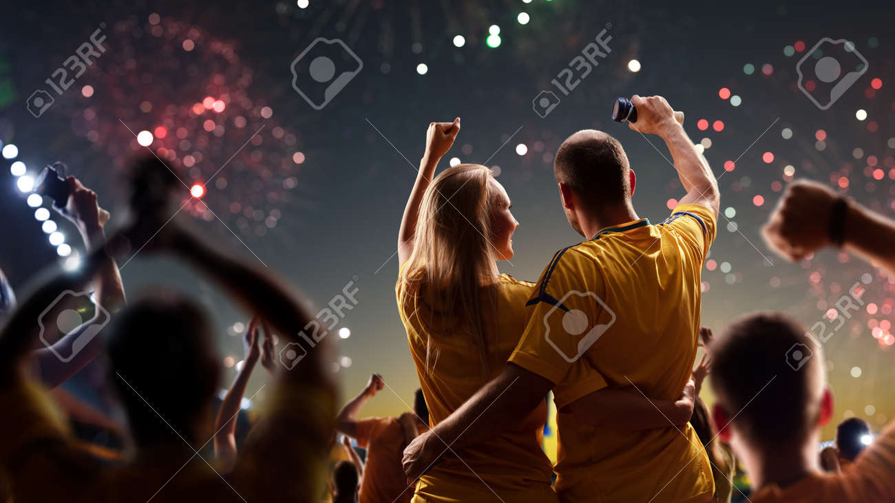 Fans celebrate in Stadium Arena night fireworks - 157252425 Fans celebrate in Stadium Arena night fireworks - 157252425