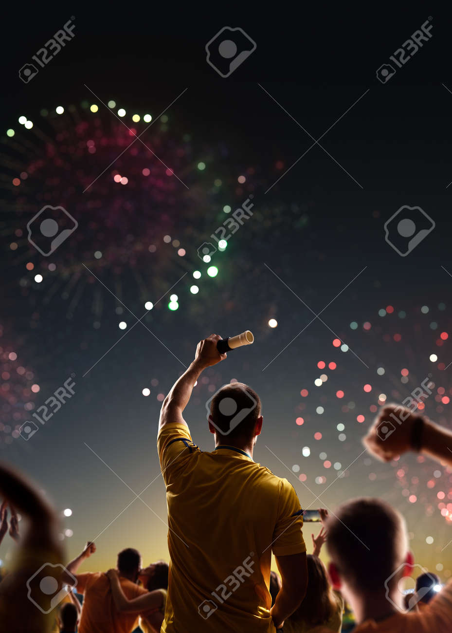 Fans celebrate in Stadium Arena night fireworks - 157292229 Fans celebrate in Stadium Arena night fireworks - 157292229