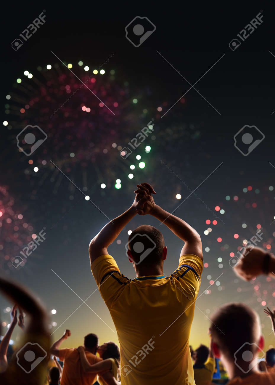 Fans celebrate in Stadium Arena night fireworks - 157252578 Fans celebrate in Stadium Arena night fireworks - 157252578