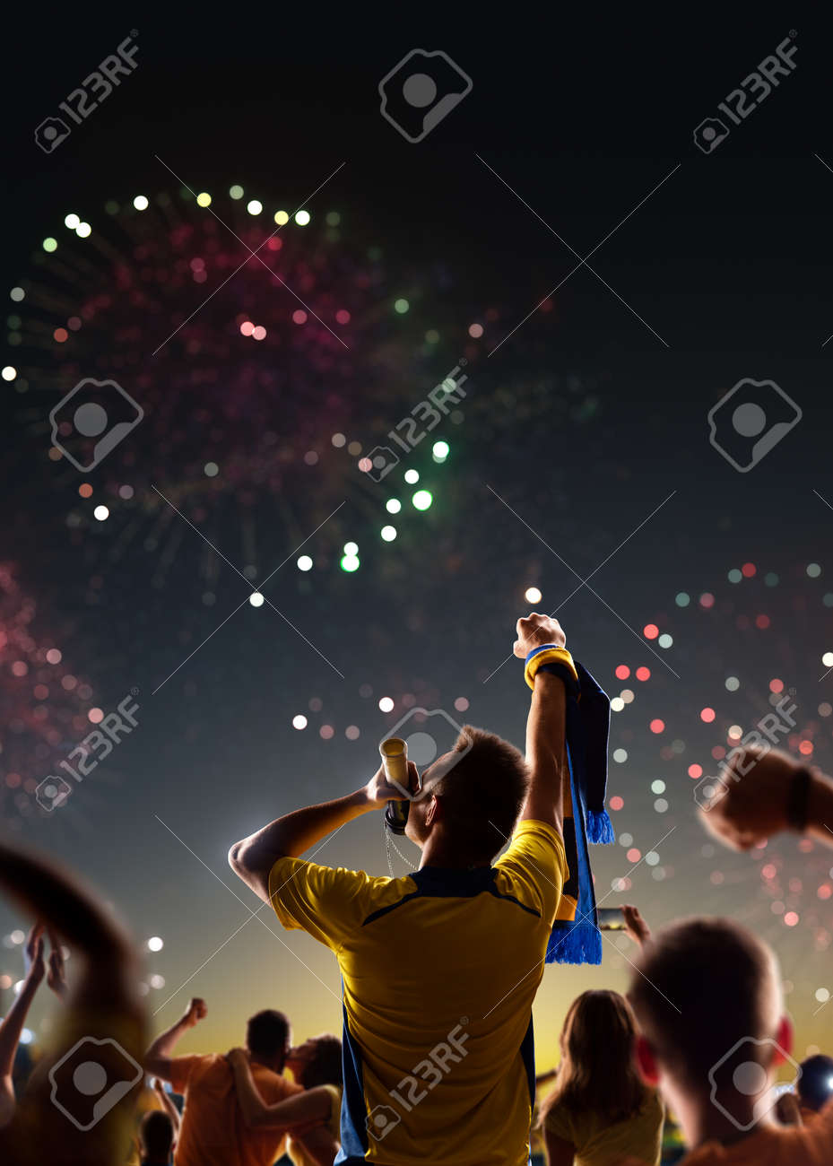 Fans celebrate in Stadium Arena night fireworks - 157252687 Fans celebrate in Stadium Arena night fireworks - 157252687