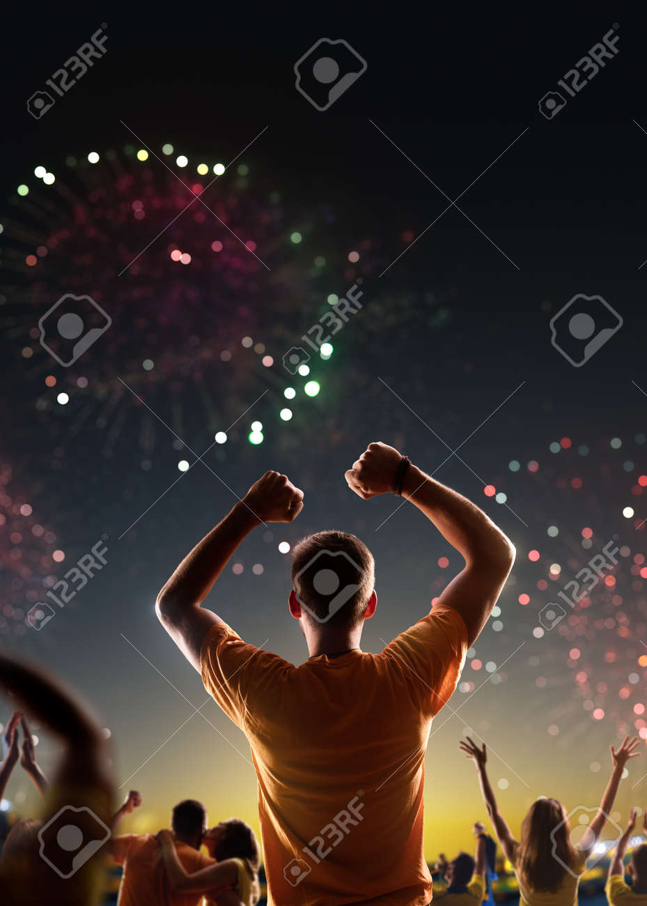 Fans celebrate in Stadium Arena night fireworks - 158199233 Fans celebrate in Stadium Arena night fireworks - 158199233