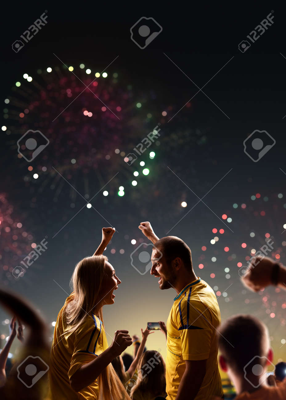 Fans celebrate in Stadium Arena night fireworks - 158199352 Fans celebrate in Stadium Arena night fireworks - 158199352