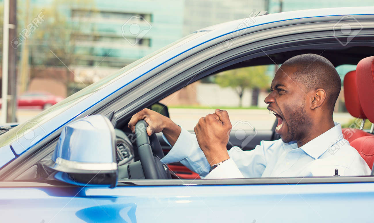 40416335-portrait-displeased-angry-pissed-off-aggressive-man-driving-car-shouting-at-someone-in-traffic-hand.jpg