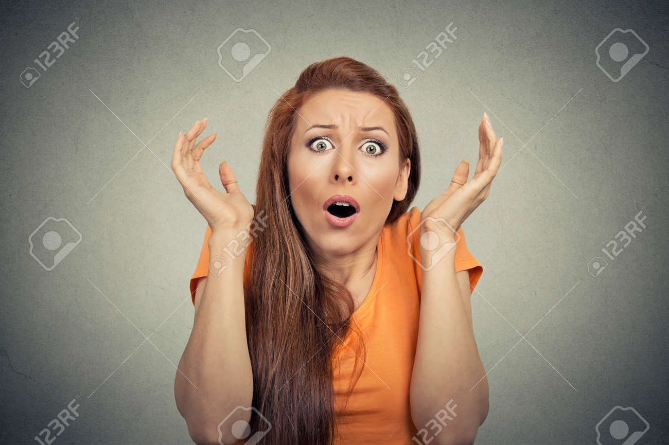 Scared Shocked Woman Isolated On Gray Background Stock Photo