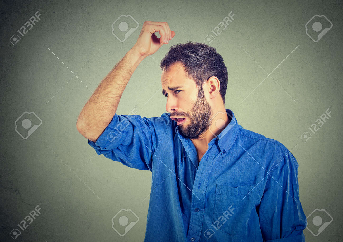 Closeup Portrait Of Young Man, Smelling, Sniffing His Armpit, Something  Stinks, Very Bad, Foul Odor Situation, Isolated On Gray Wall Background.  Negative Emotion, Facial Expression, Feeling Stock Photo, Picture and  Royalty Free, image size:1300x915