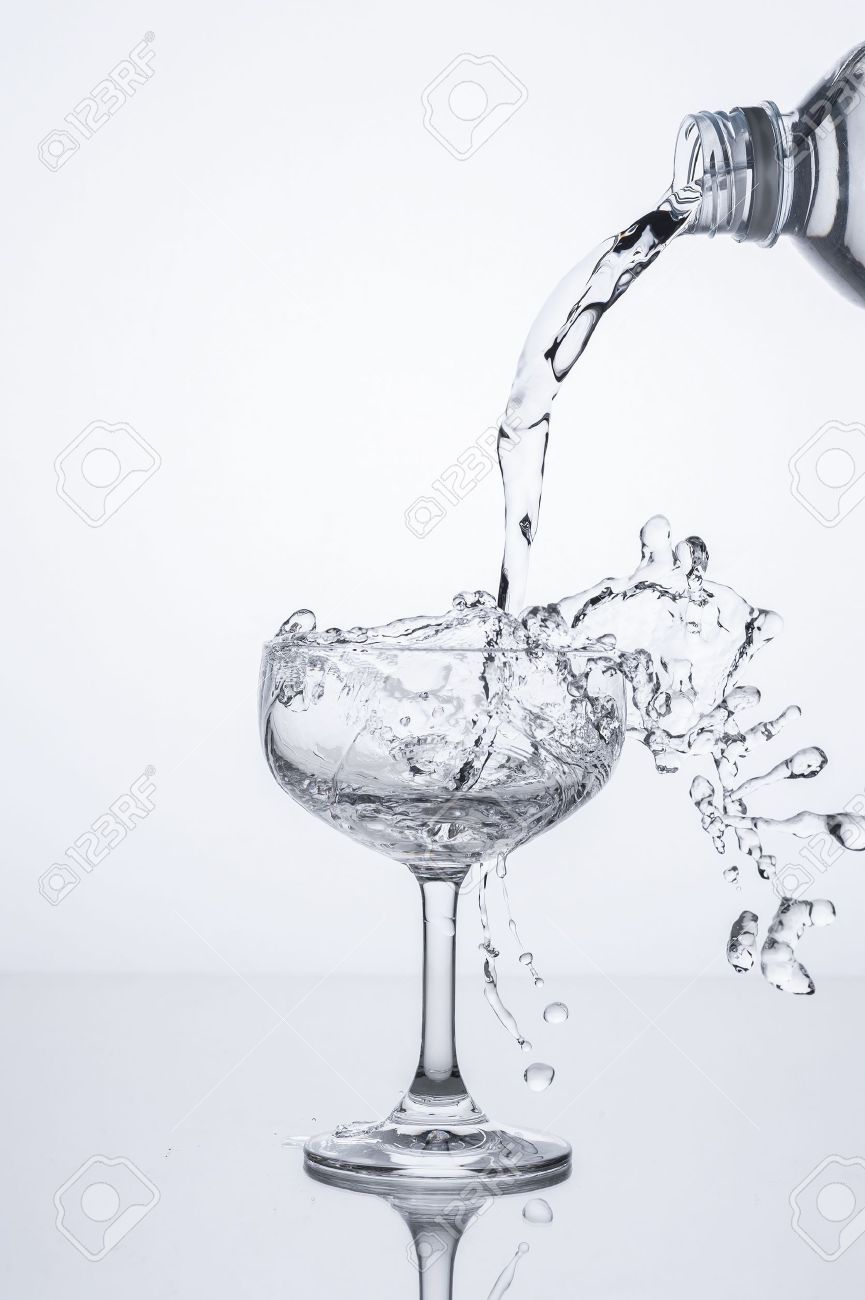 pouring water into glass stock photo picture and royalty free image