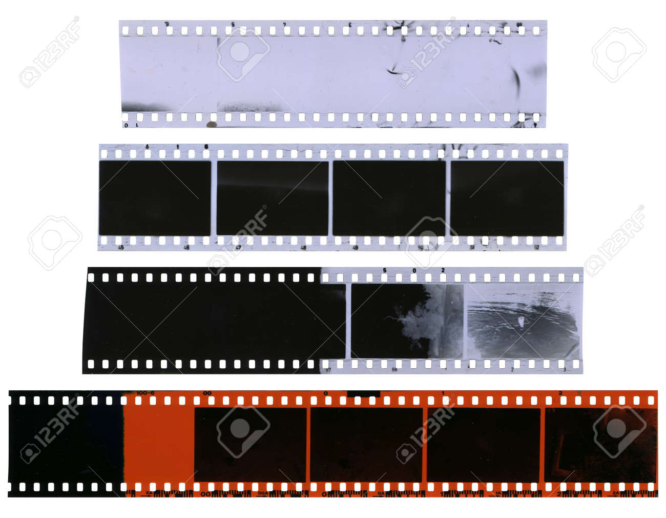 Old, Used, Dusty And Scratched Celluloid Film Strips Isolated On