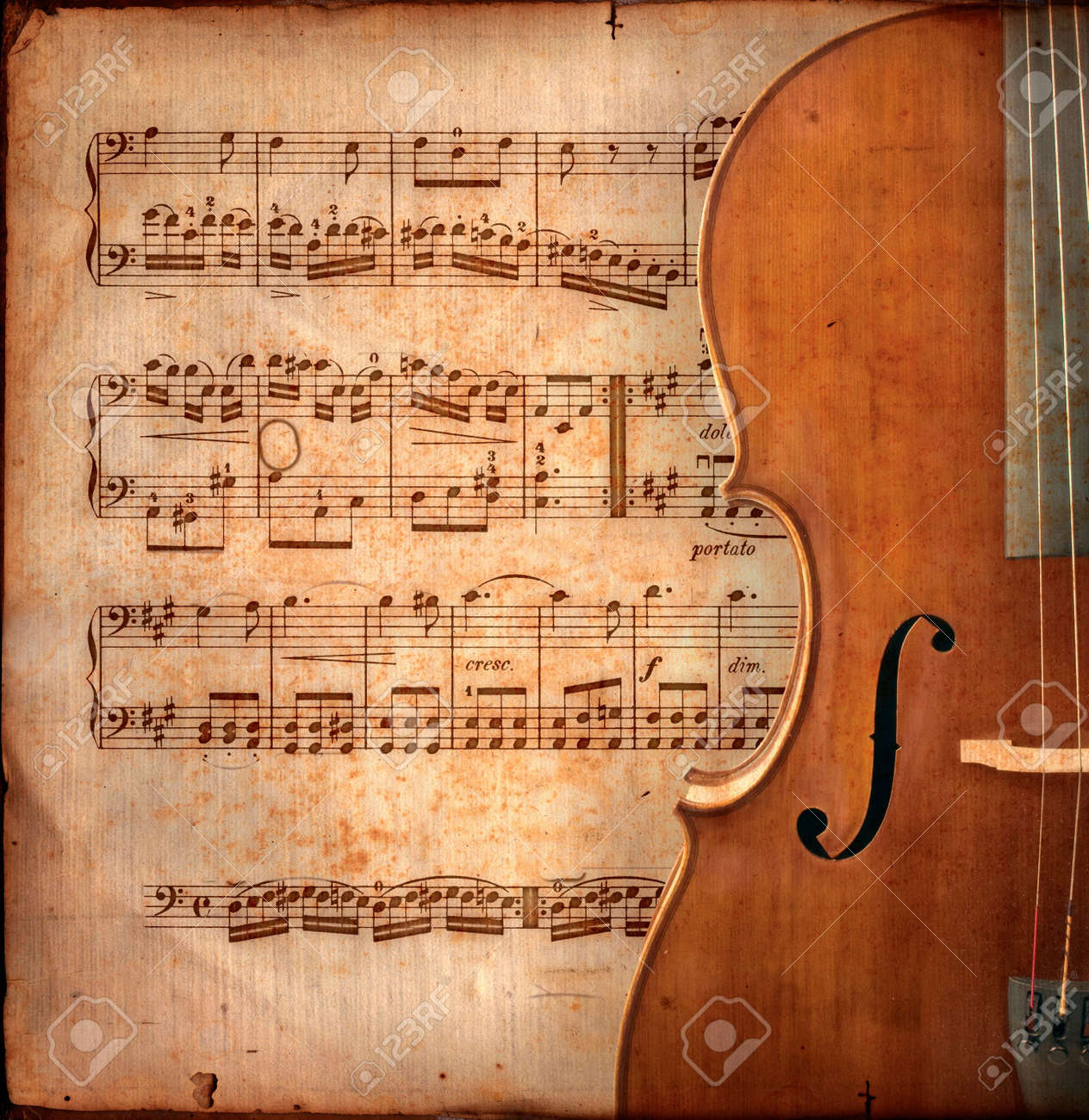 cello on ancient music sheet rusted old yellow paper with guitar music on paper