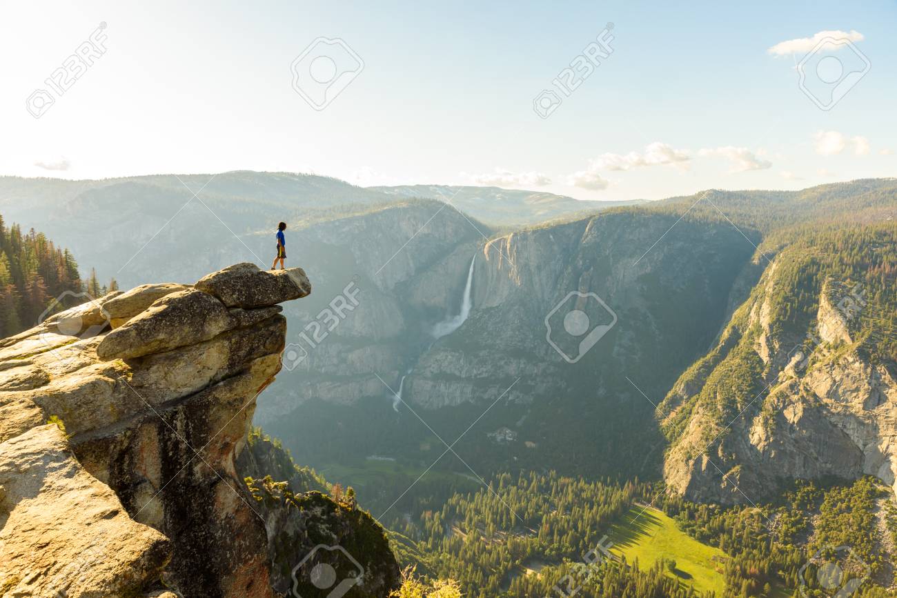 Hiker at the Glacier Point with View to Yosemite Falls and Valley in the Yosemite National Park, California, USA - 92067868 Hiker at the Glacier Point with View to Yosemite Falls and Valley in the Yosemite National Park, California, USA - 92067868