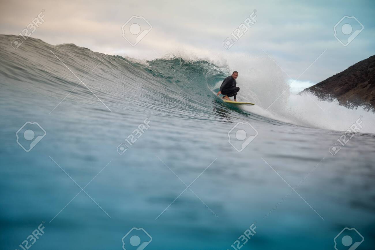surfer riding waves on the island of fuerteventura - 138648553 surfer riding waves on the island of fuerteventura - 138648553