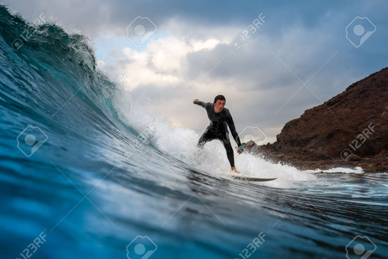 Surfer riding waves on the island of fuerteventura in the Atlantic Ocean, Canary Islands - 140114374 Surfer riding waves on the island of fuerteventura in the Atlantic Ocean, Canary Islands - 140114374