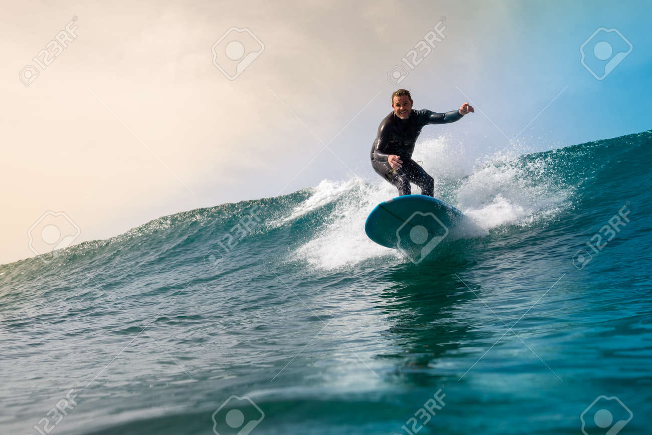 Surfer riding waves on the island of fuerteventura in the Atlantic Ocean, Canary Islands - 142103977 Surfer riding waves on the island of fuerteventura in the Atlantic Ocean, Canary Islands - 142103977