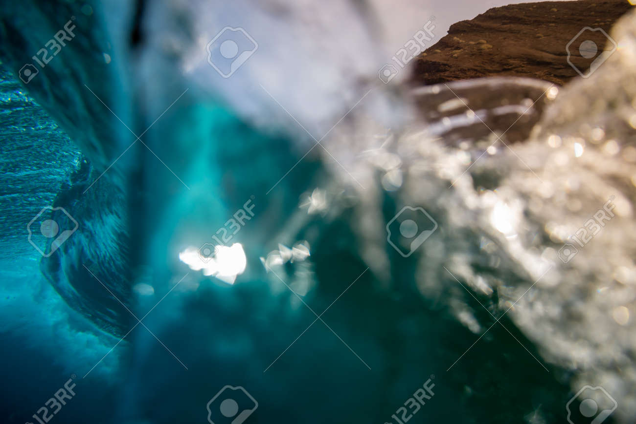 breaking wave with the tube and blue water with the clouds at the background - 142154208 breaking wave with the tube and blue water with the clouds at the background - 142154208