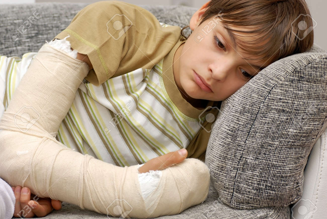 sad teenage caucasian boy with broken arm bone - 12026978 sad teenage caucasian boy with broken arm bone - 12026978