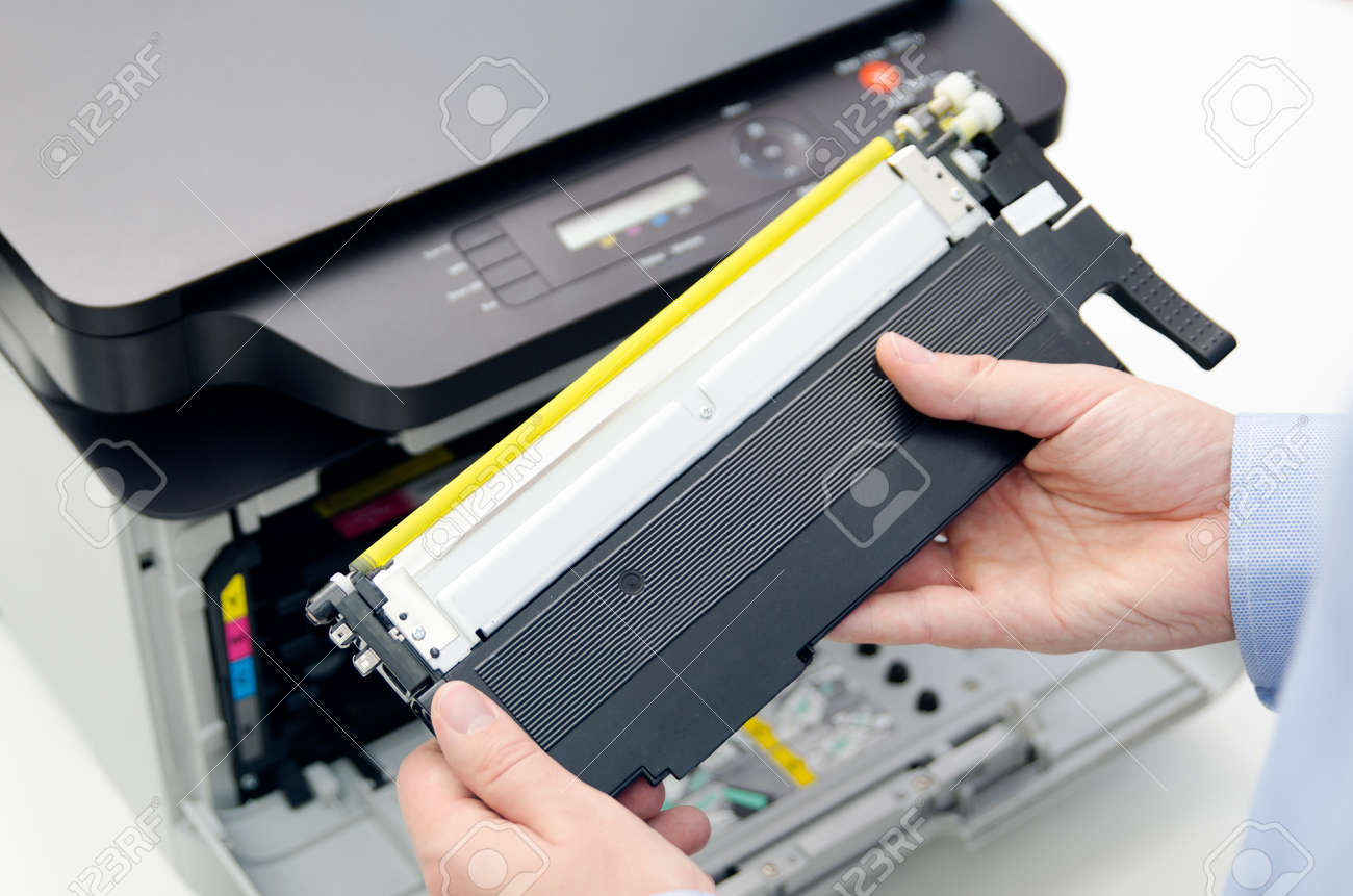 Man replacing toner in laser printer. toner printer cartridge print laser  office supplies refill concept