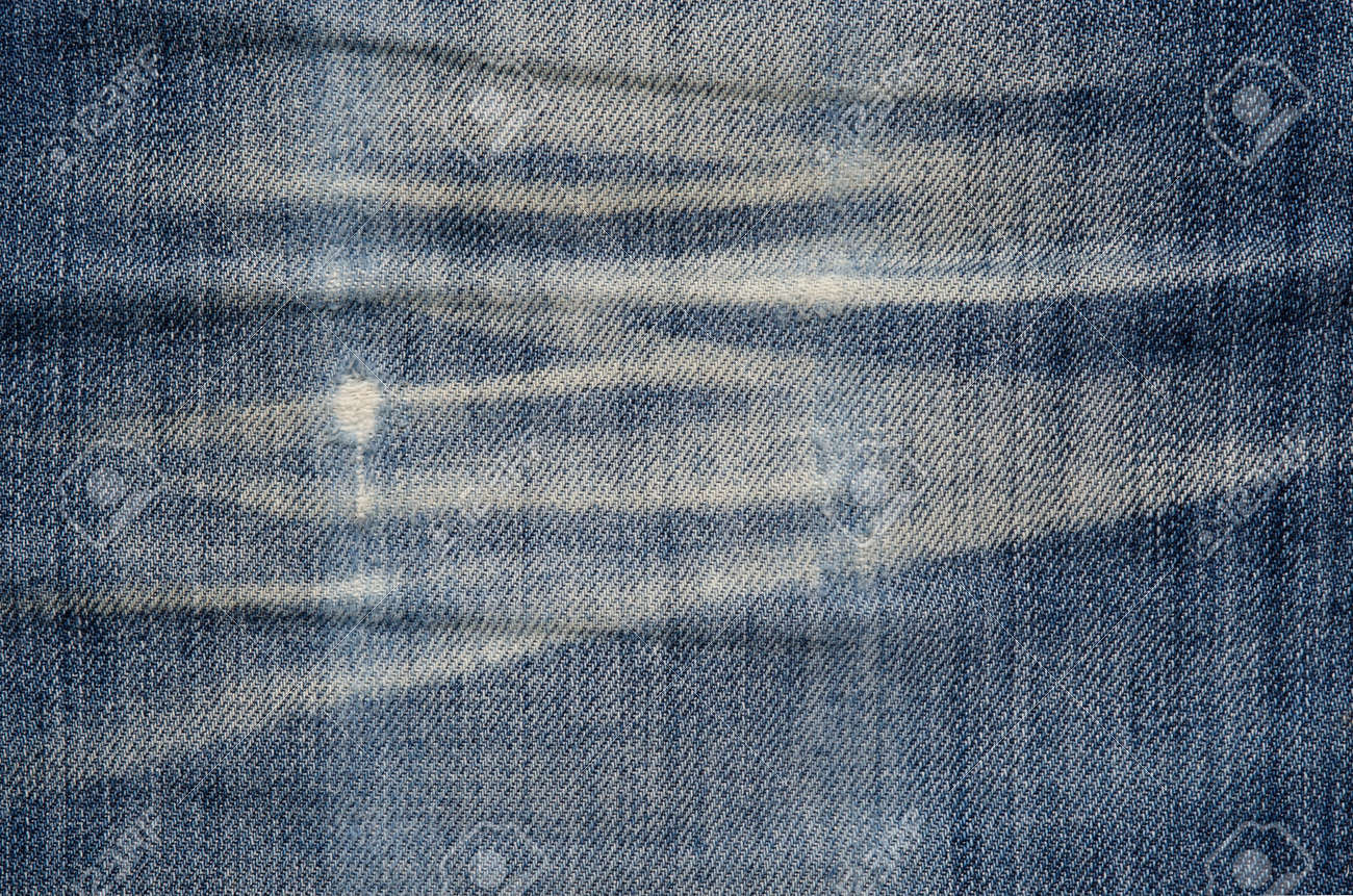 Texture Of Blue Denim Fabric. Denim Jeans Material Texture Creased Dirty  Background Pattern Concept Stock Photo, Picture and Royalty Free Image.  Image 95803080., image size:1300x861