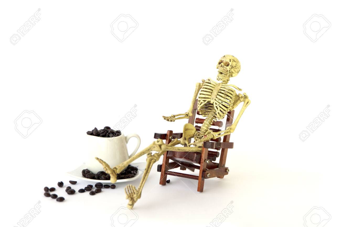 human skeleton sit on a chair on white background stock photo