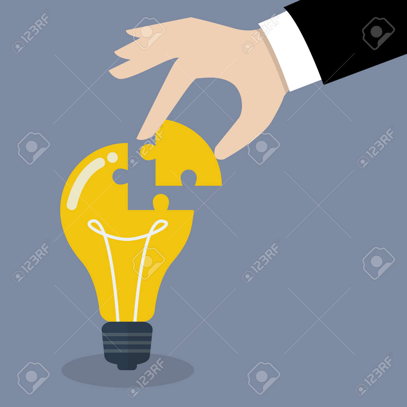 Hand inserts the missing puzzle in lightbulb. Business idea concept - 43529415 Hand inserts the missing puzzle in lightbulb. Business idea concept - 43529415