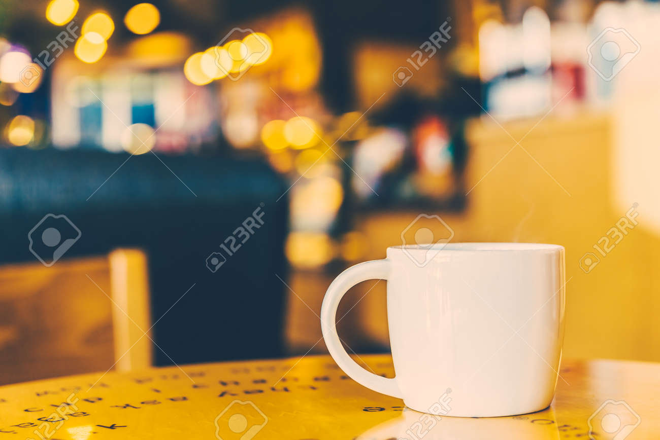 Black Coffee Mug On Wooden Table In Coffee Shop Vintage Retro Stock Photo Picture And Royalty Free Image Image 36018719