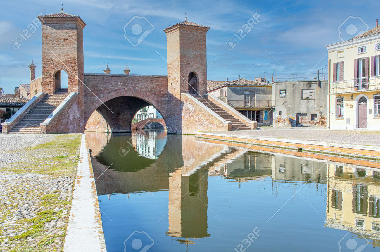 Comacchio, Italy - often compared to Venice for the canals and the architecture, Comacchio displays one of the most characteristic old towns in Emilia Romagna - 170490481 Comacchio, Italy - often compared to Venice for the canals and the architecture, Comacchio displays one of the most characteristic old towns in Emilia Romagna - 170490481