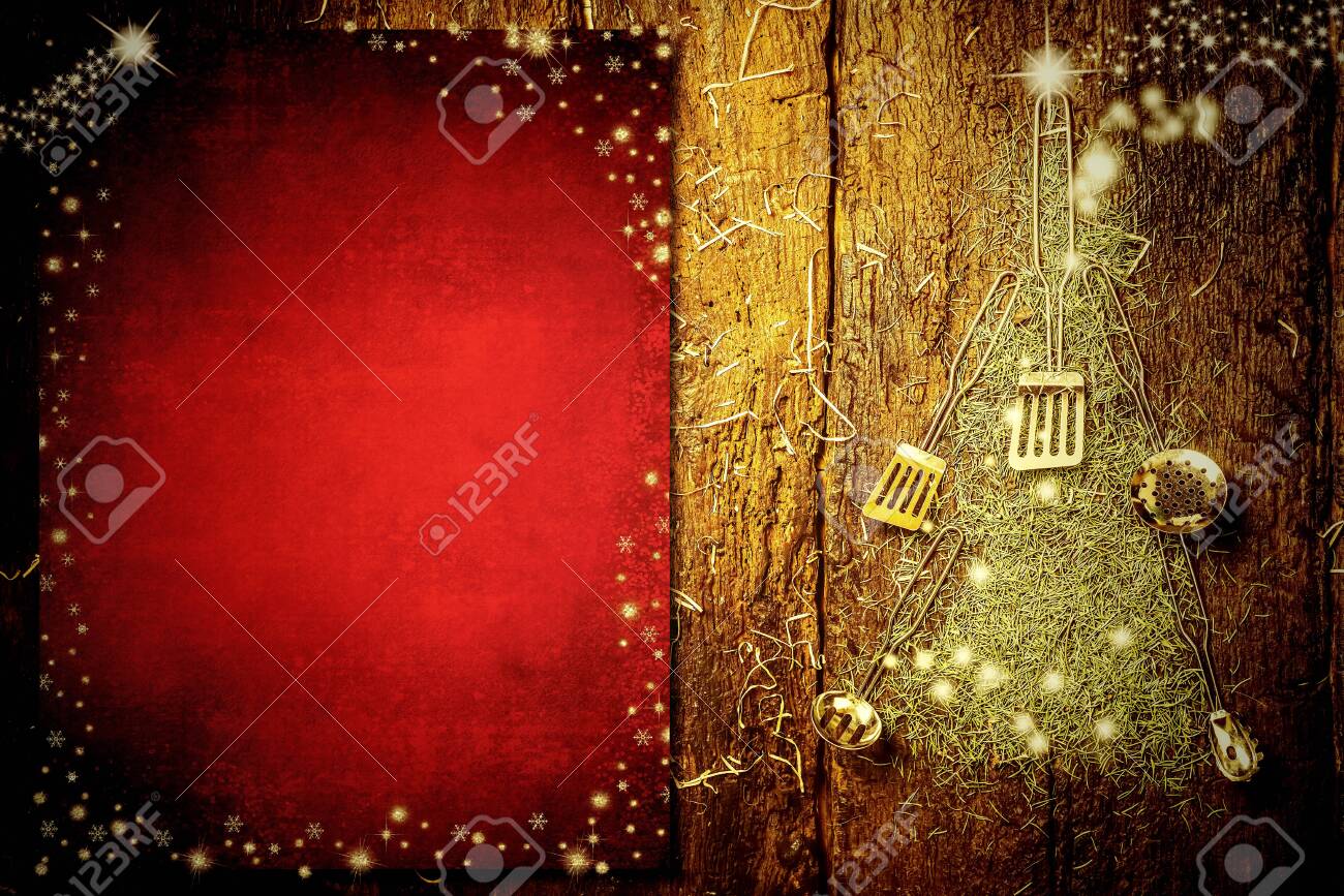 Background invite to write Christmas menu. Old kitchen utensils forming a Christmas tree and blank red paper on old wooden background. - 134710332 Background invite to write Christmas menu. Old kitchen utensils forming a Christmas tree and blank red paper on old wooden background. - 134710332