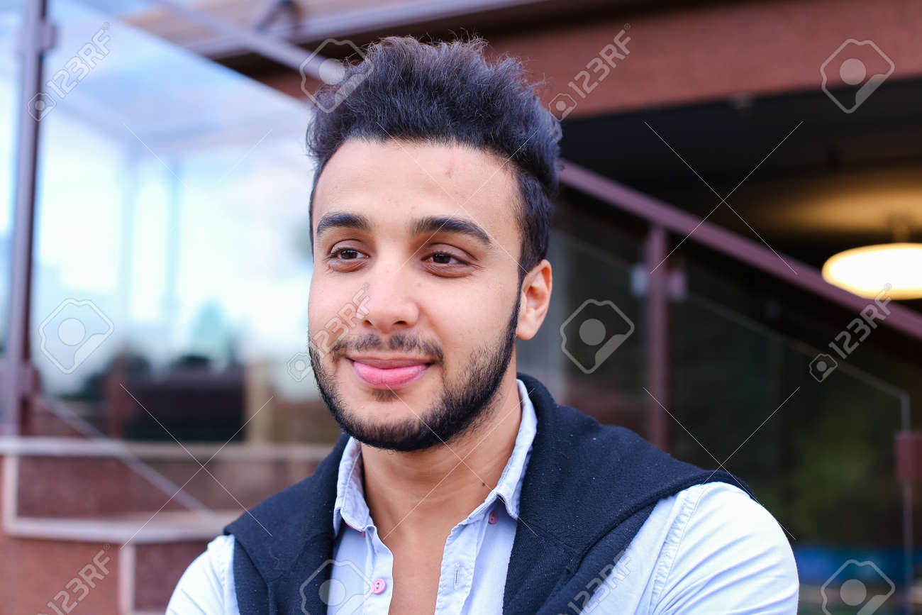 Portrait Of Beautiful Arab Guy Happy Young Man Smiling Big Smile And Looking In Camera Portrait Of Beautiful Arab Guy Happy Young Man Smiling Big Smile And Looking In Camera