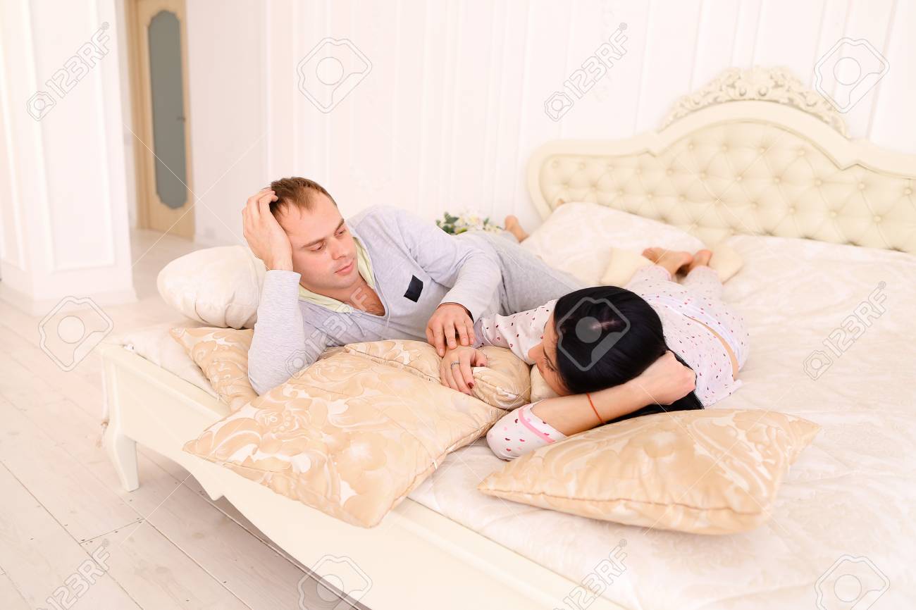 Young Happy Family Together Girl And Guy Embracing In Bed Wife
