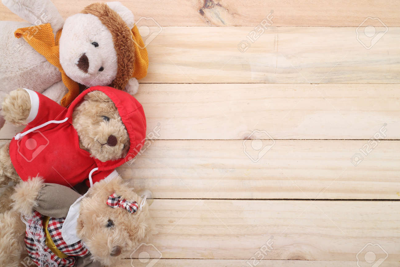 three cute teddy bear on wood background stock photo picture and