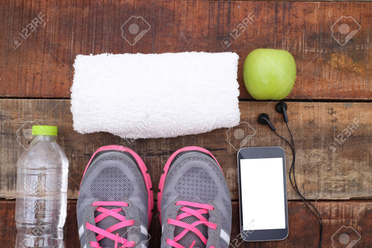 Sport shoes and water with set for sports activities on tiled floor. - 46019956 Sport shoes and water with set for sports activities on tiled floor. - 46019956