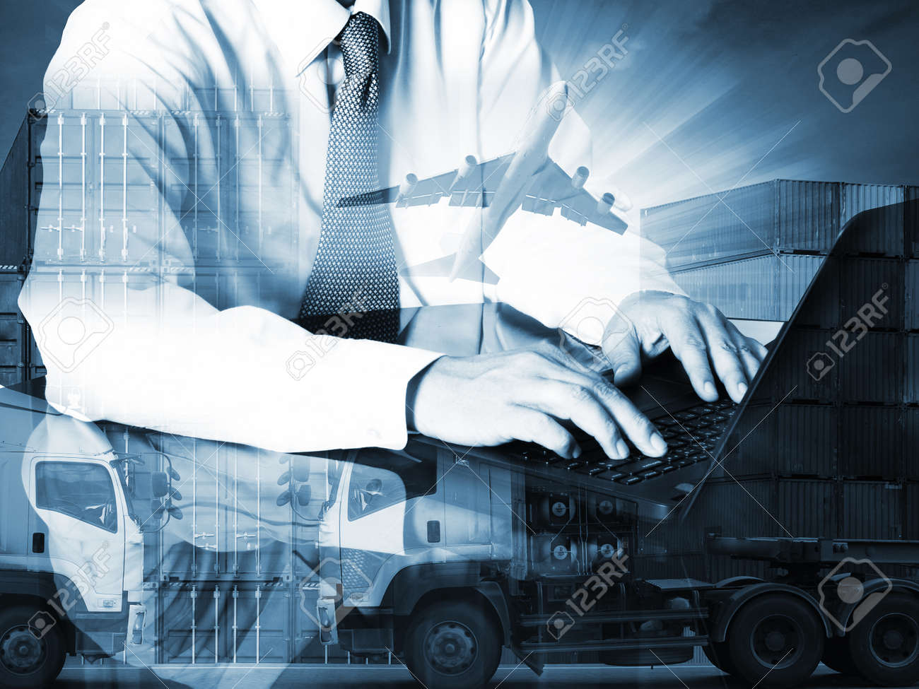Double exposure of success businessman using computer with container truck ,ship in port and freight cargo plane in transport and import-export commercial logistic ,shipping business industry - 48795748 Double exposure of success businessman using computer with container truck ,ship in port and freight cargo plane in transport and import-export commercial logistic ,shipping business industry - 48795748