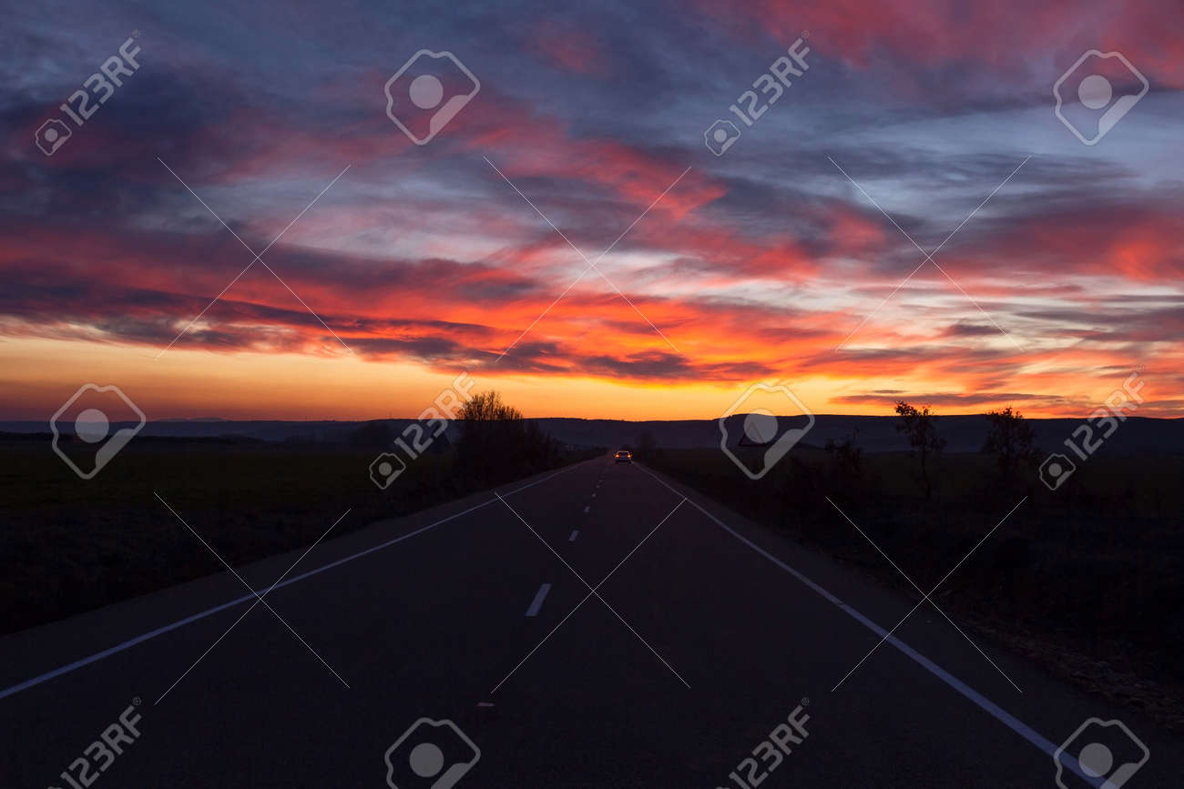 straight road with car in the background and horizon with beautiful horizon background