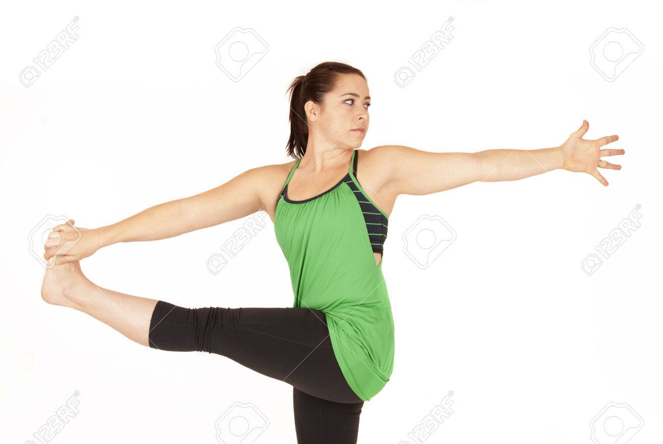 Female yoga instructor in standing twist pose Female yoga instructor in standing twist pose
