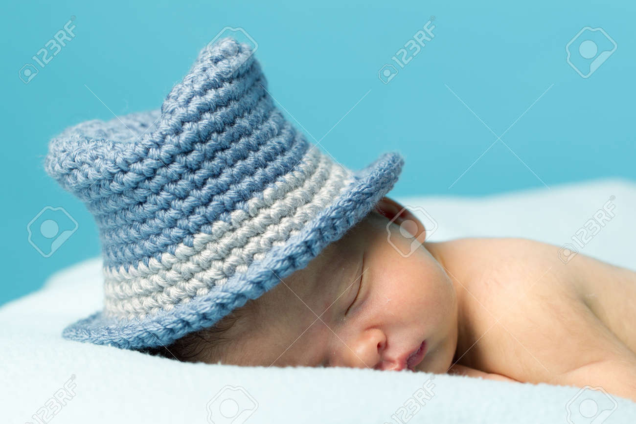 hat on newborn while sleeping