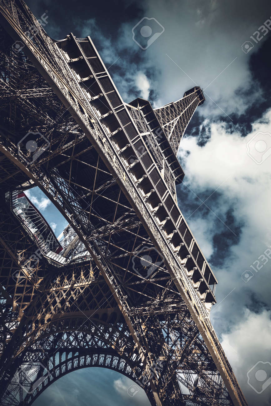 Low Angle View Of Eiffel Tower Against Dramatic Cloudy Sky Landmark Stock Photo Picture And Royalty Free Image Image 97792501