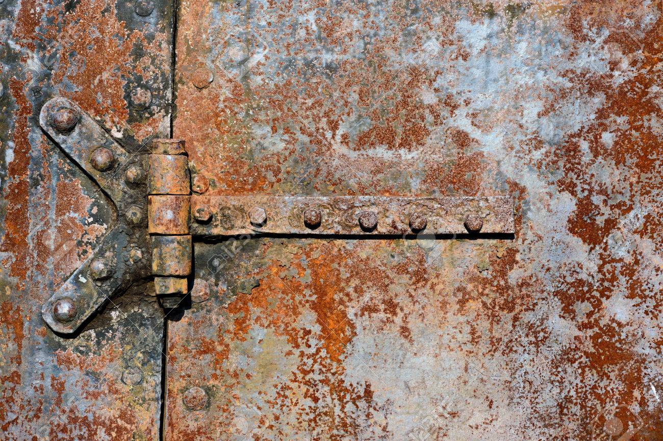 Rusty Metal Door backgrounds and textures: rusty metal door surface with riveted Rusty Metal Door backgrounds and textures: rusty metal door surface with riveted