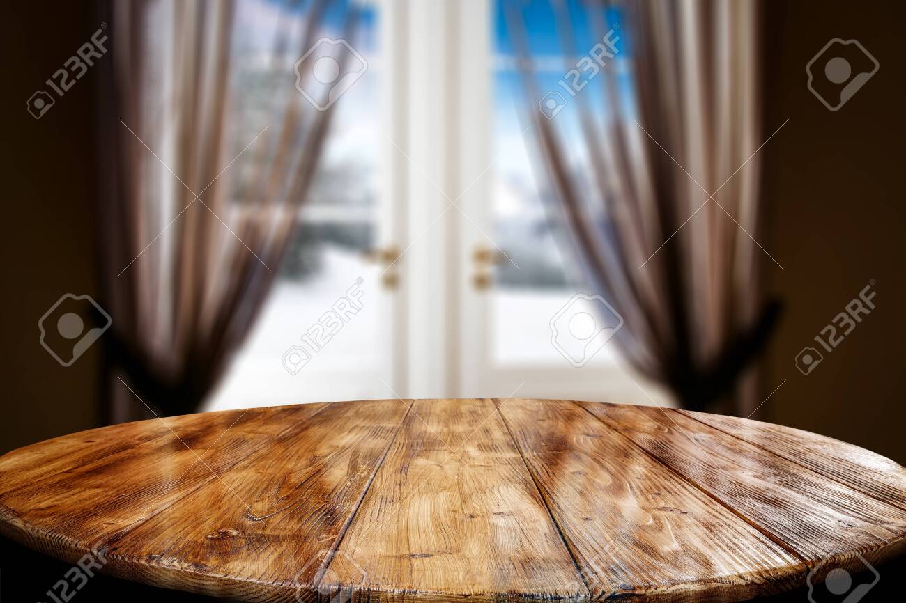 Wooden Table Top With A Blurred Window And Curtains With Home Interior Background Empty Space For Your Products And Decoration Stock Photo Picture And Royalty Free Image Image 133353123