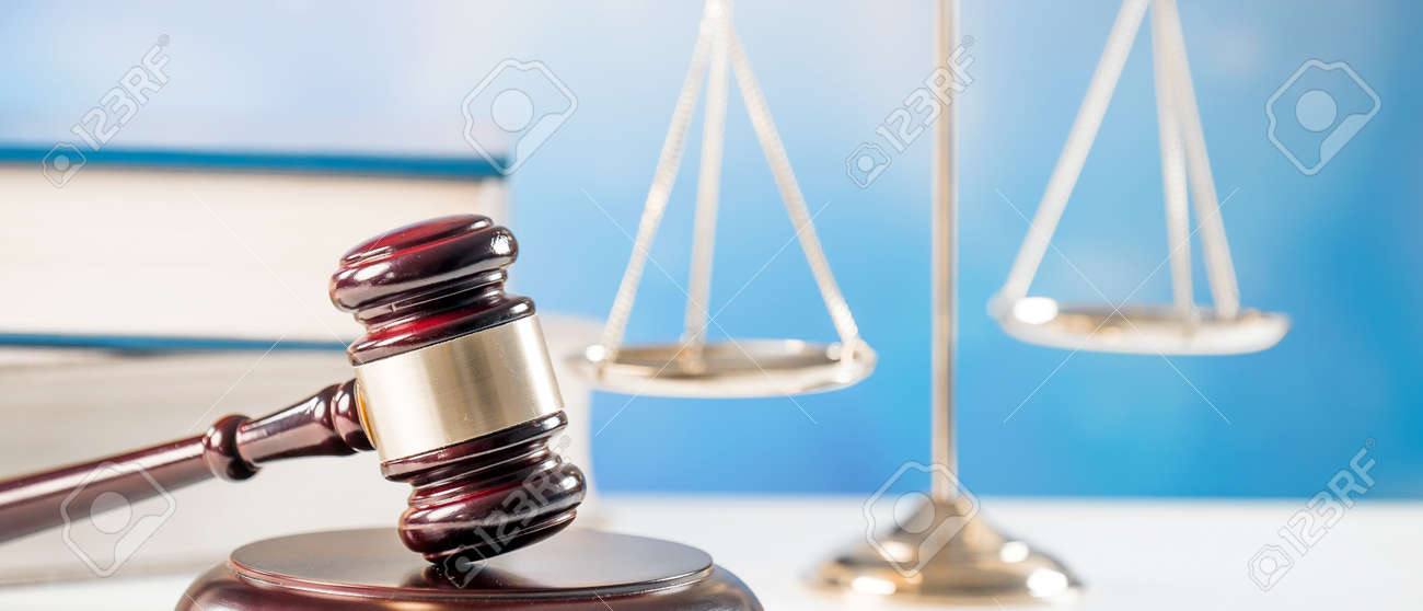 Law, justice and legal system concept with a wooden gavel judge symbol on blue background. - 92440890 Law, justice and legal system concept with a wooden gavel judge symbol on blue background. - 92440890