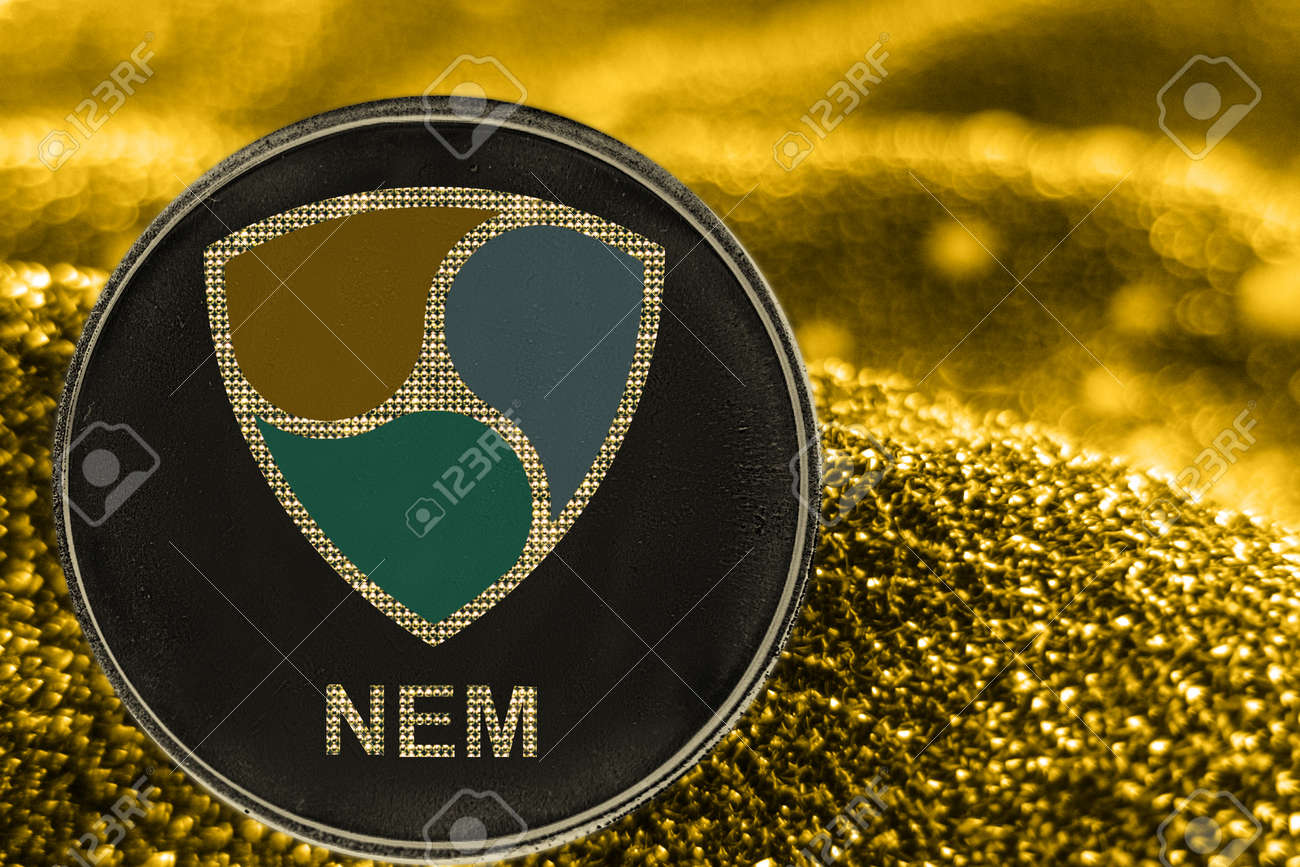 Coin Cryptocurrency NEM And Gold Fabric Background. Crypto Token Xem. Stock  Photo, Picture and Royalty Free Image. Image 126056077.