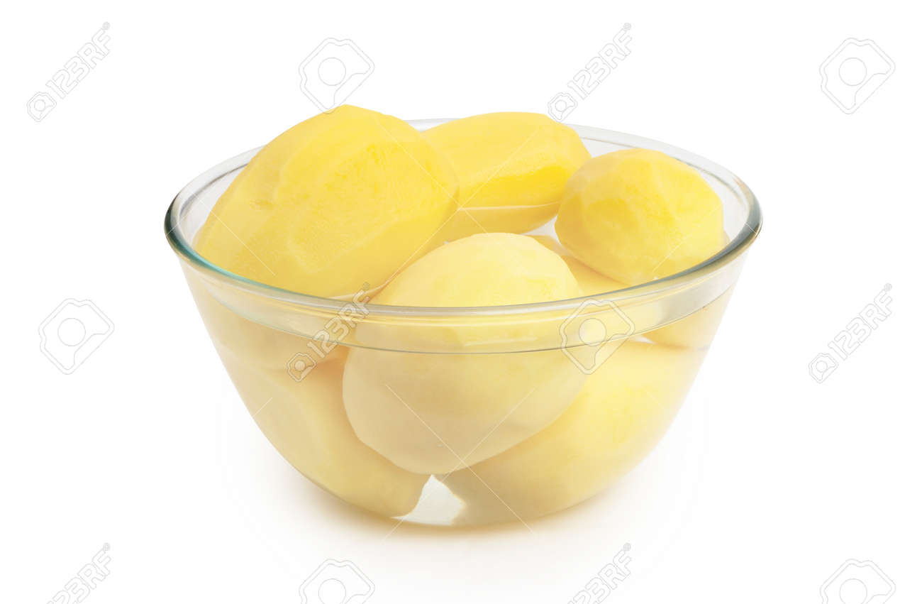 Peeled potatoes in a glass bowl isolated on white background. - 167240274 Peeled potatoes in a glass bowl isolated on white background. - 167240274