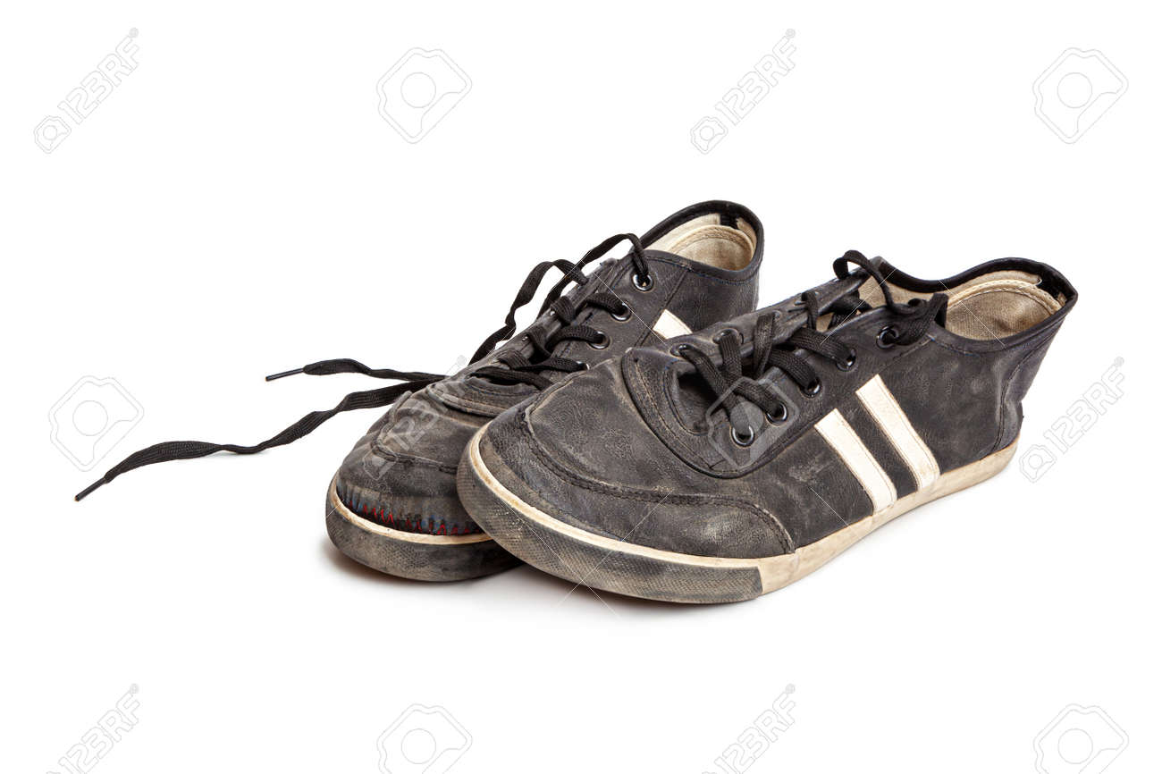 Dirty old black sneakers isolated on a white background - 170242793 Dirty old black sneakers isolated on a white background - 170242793