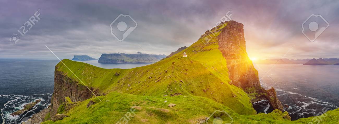 Shot Of Beautiful Panoramic Scene, Sunrise Over Kalsoy Island and Kallur lighthouse, Faroe Islands - 105398041 Shot Of Beautiful Panoramic Scene, Sunrise Over Kalsoy Island and Kallur lighthouse, Faroe Islands - 105398041